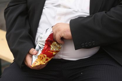 Man eating junk food