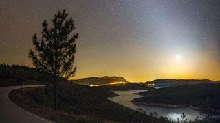 This vertical panorama, composed of four images, shows a strong zodiacal light coming from the region where planet Venus was located, in the western sky of Pampilhosa da Serra, Dark Sky Aldeias do Xisto, Portugal. 