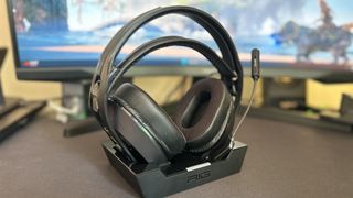 Nacon RIG 800 Pro HS headset in charging dock on a desk