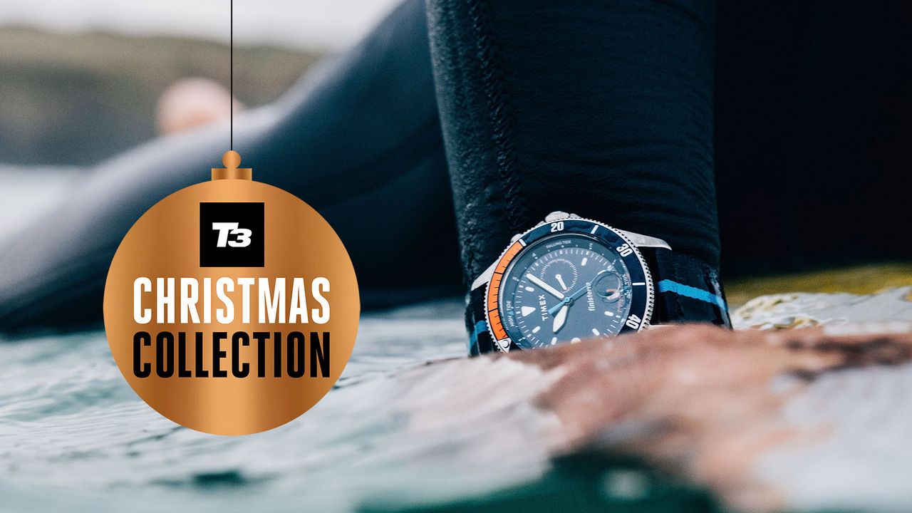 Surfer wearing Timex x Finisterre Tide Watch