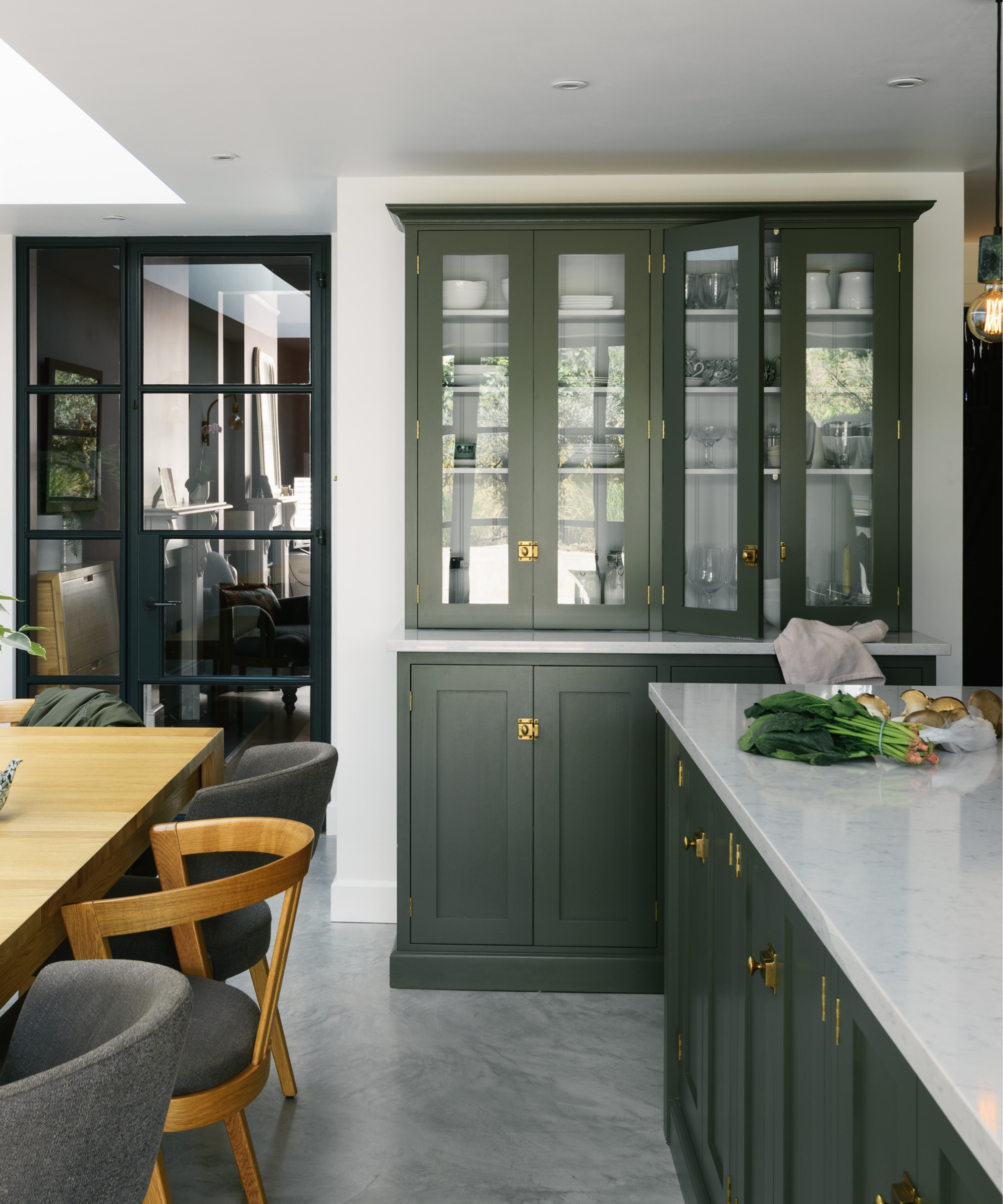 a white and green larder with deVOL's glazed larder cabinet painted dark green
