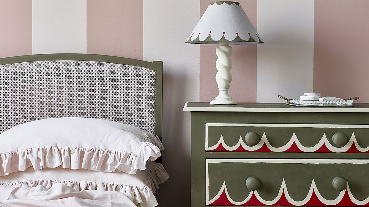 Annie Sloan painted chest of drawers next to bed.