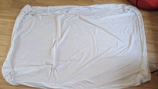 Fitted sheet out flat on floor