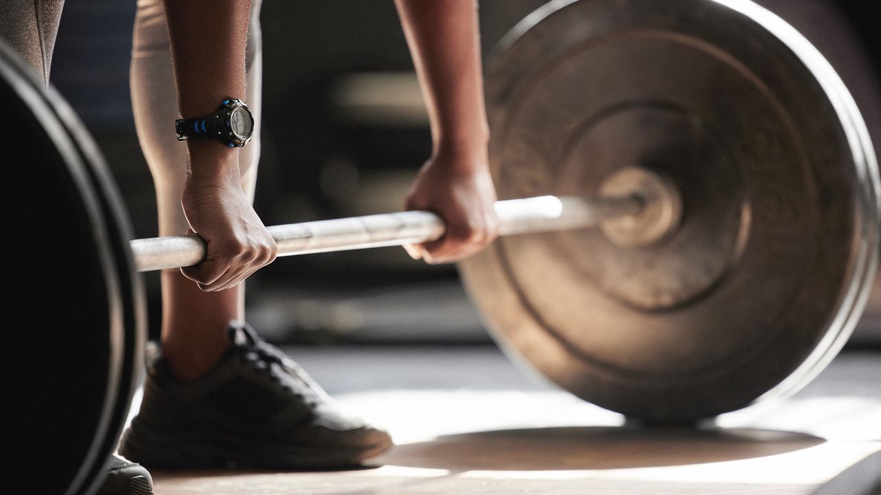 Detail of woman lifting weights