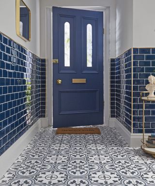 Kit Kemp inspired hallway with blue patterned tiles