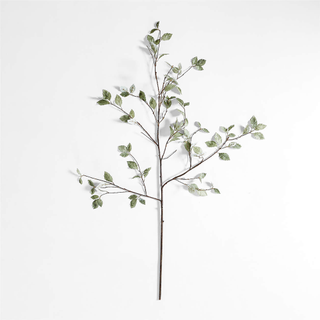 A faux branch with sage green leaves