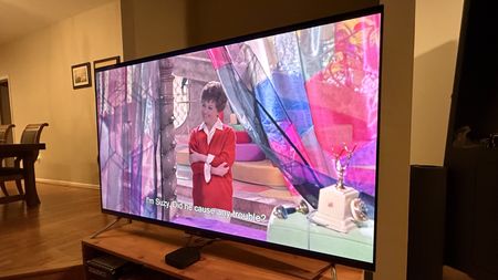 Amazon Fire TV Omni QLED (2025) showing image of woman