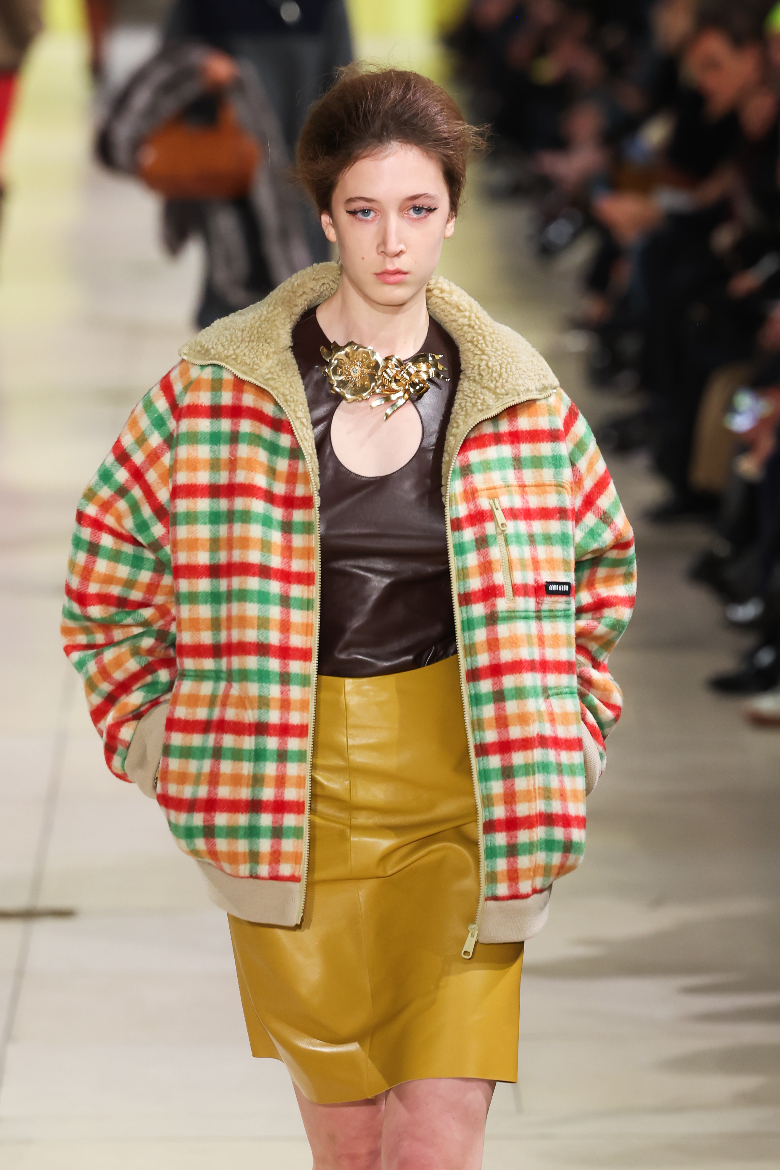 A model walks the runway during the Miu Miu Womenswear Fall/Winter 2025-2026 show as part of Paris Fashion Week at Palais d'Iena on March 11, 2025 in Paris, France.