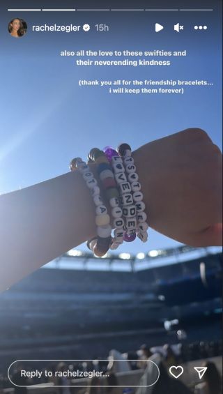 rachel zegler showing off friendship bracelets at eras tour.
