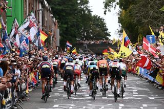 LEUVEN BELGIUM SEPTEMBER 26 A general view of the Peloton competing while fans cheer during the 94th UCI Road World Championships 2021 Men Elite Road Race a 2683km race from Antwerp to Leuven flanders2021 on September 26 2021 in Leuven Belgium Photo by Alex Broadway PoolGetty Images