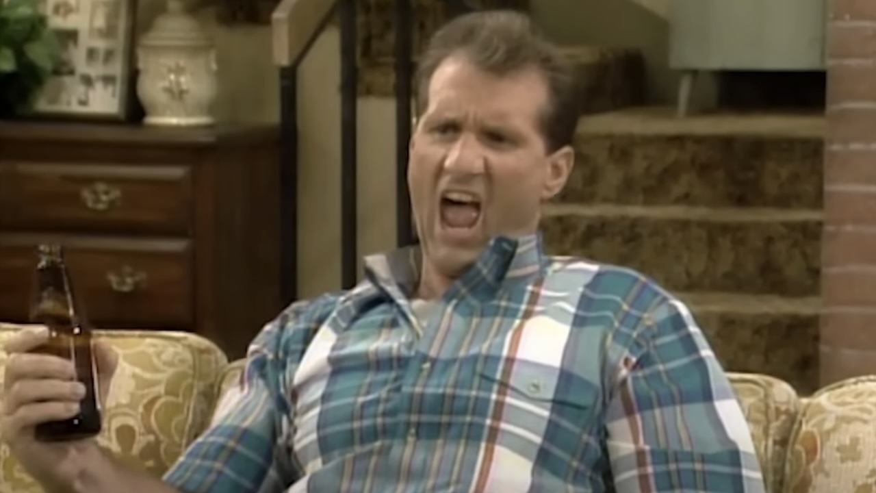Al Bundy holding a beer in Married with Children