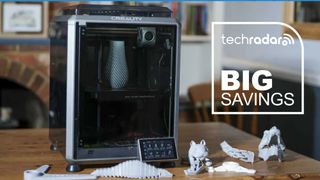 The Creality K1C during our home printing tests, with a TechRadar badge next to it reading 'Big Savings'