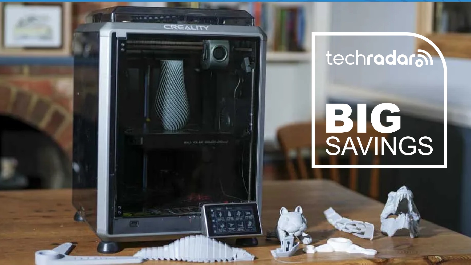 The Creality K1C during our home printing tests, with a TechRadar badge next to it reading 'Big Savings'