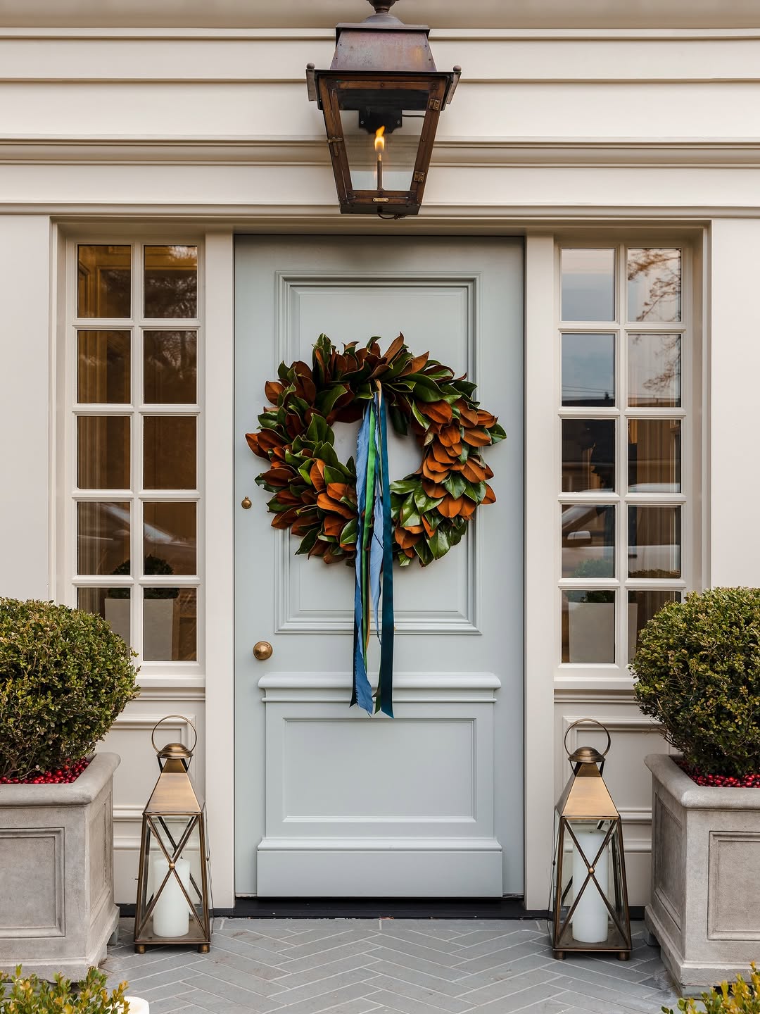 Classic home front door with 10 light side panels and pale blue paint