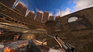 Screenshot from Dieseldome, showing a first-person view of a crossbow shooting a grapple hook into a Roman colosseum.