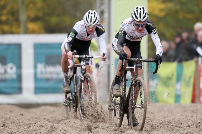 Lubomir Petrus leads his BKCP-Powerplus teammate Dieter Vanthourenhout through the sand at GP Hasselt