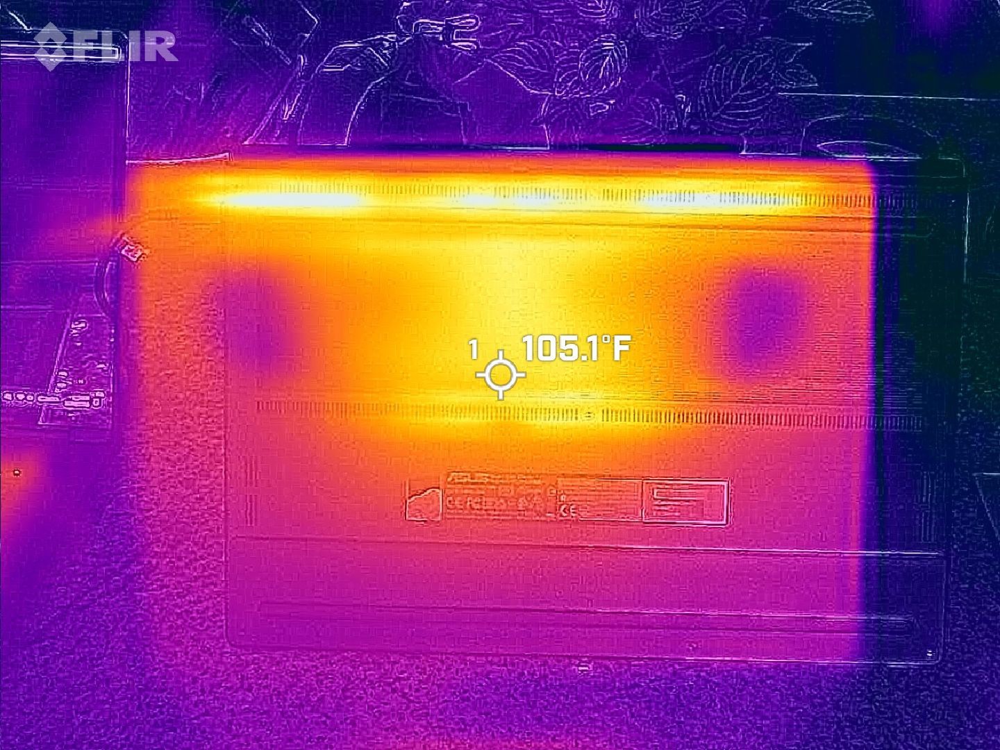 FLIR thermal image of the ASUS ProArt P16 laptop underside, highlighting heat dissipation along the vents and a center reading of 105.1°F between the cooler fan intakes.