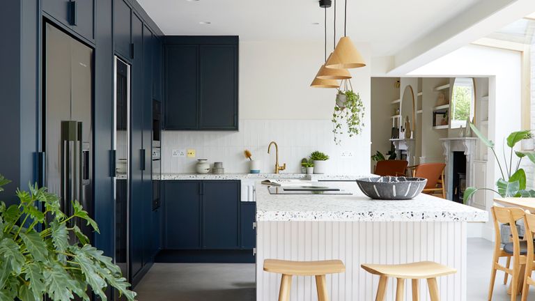 Blue and white open plan kitchen