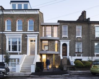 a narrow infill house between two properties