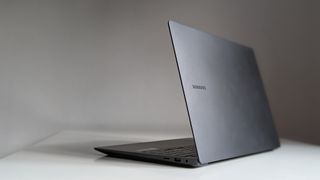 The open lid of a Samsung Galaxy Book3 Ultra on a white desk