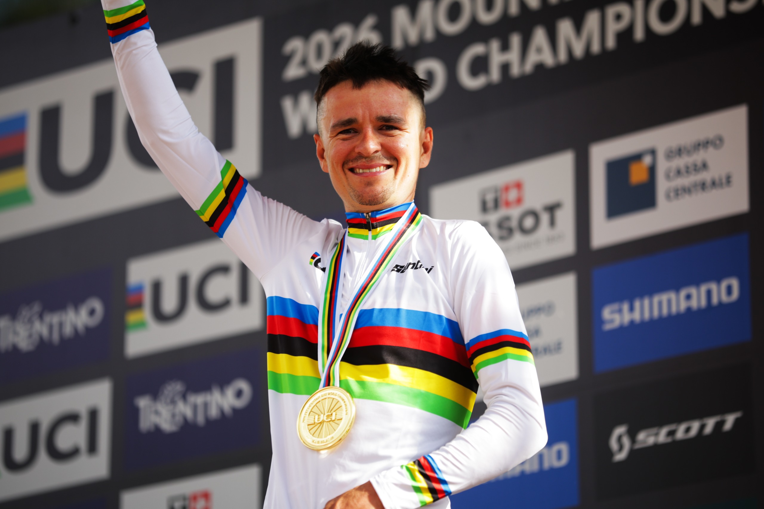 Tom Pidcock in a rainbow jersey after winning the mountain bike world championships