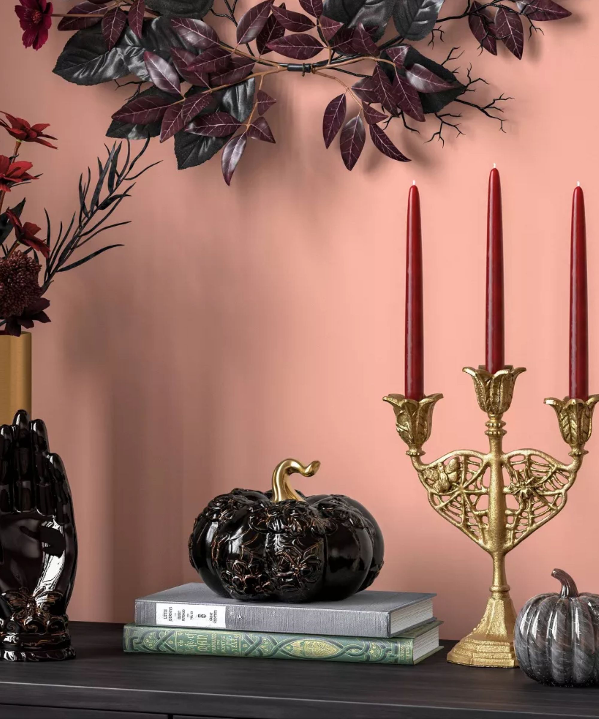 Halloween mantel with gold candelabra and black glass pumpkin