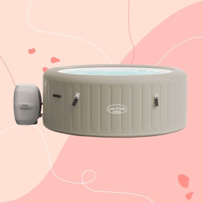 The grey Lay-Z-Spa Barbados inflatable hot tub on a pink background