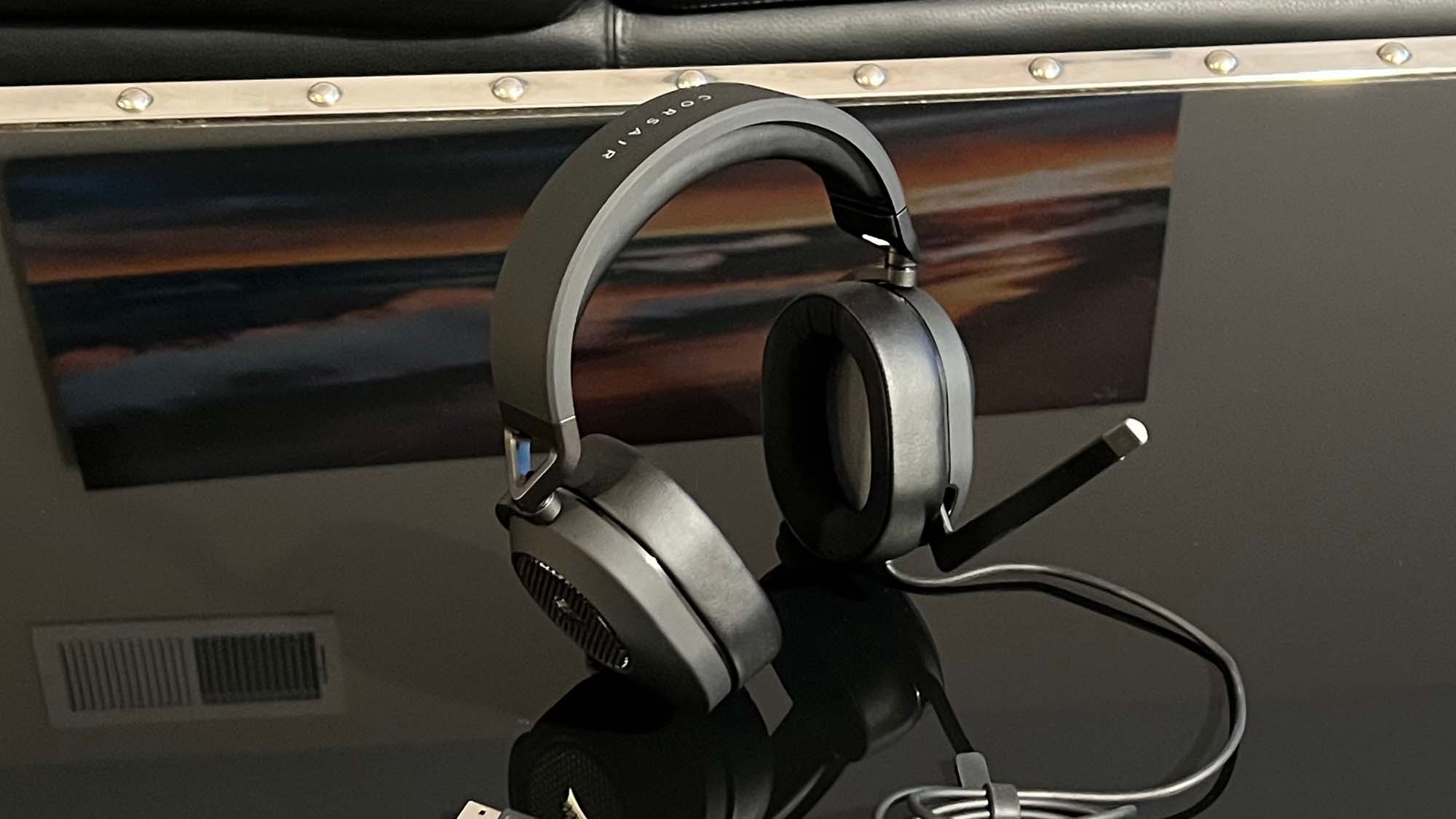 A Corsair HS65 Surround on a reflective black table