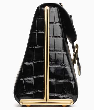 Black leather handbag with gold frame