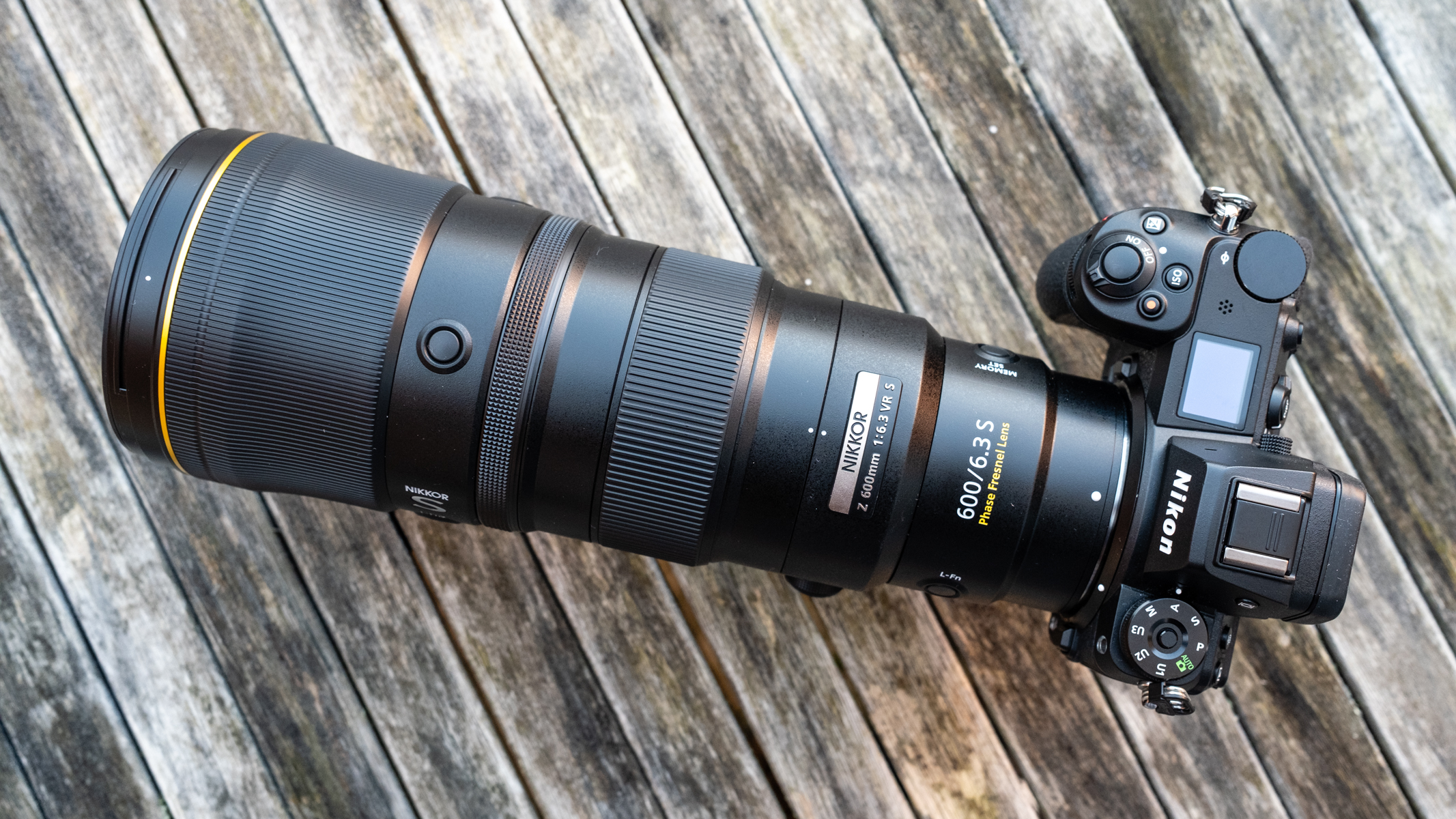 Nikkor Z 600mm f/6.3 VR S  attached to a Nikon Z 7II on a frosty wooden table