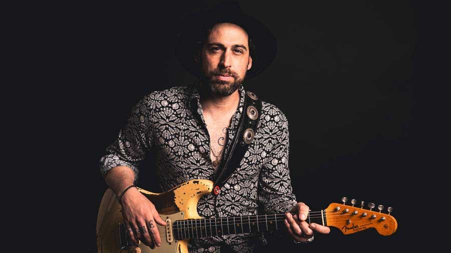 Dan Patlansky holding a guitar