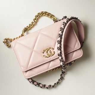 pink Chanel wallet on a chain