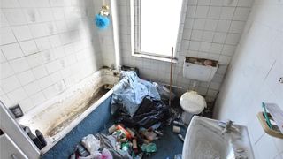 Neglected bathroom in two-bed house for sale