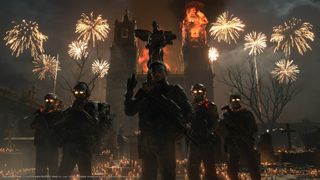 Neil leads his squad in front of fireworks in front of a church on fire in Death Stranding 2: On The Beach