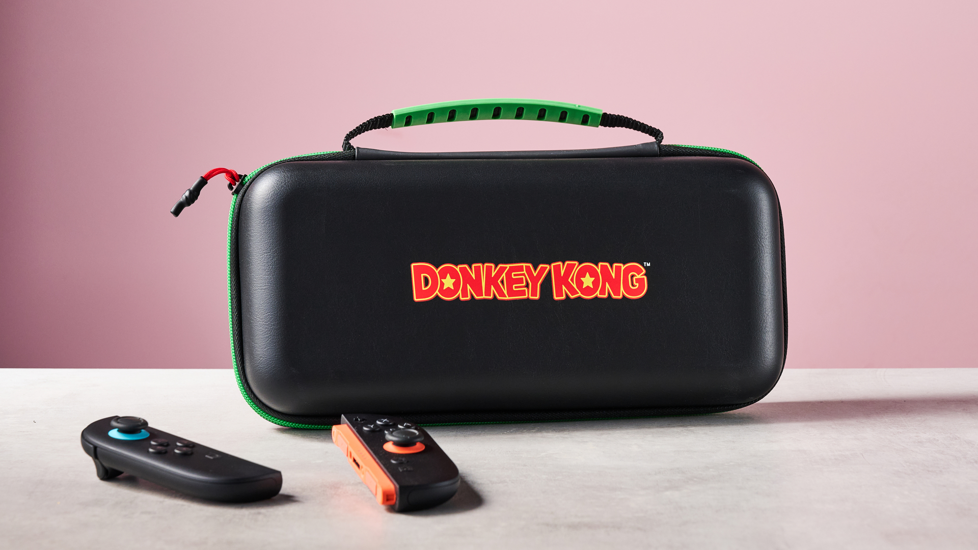 Turtle Beach PlayTrek Travel Case for Nintendo Switch 2 on table with Joy-Con 2 controllers