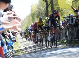 Team INEOS Grenadiers Britains Ben Turner R leads the pack during the 119th edition of the ParisRoubaix oneday classic cycling race between Compiegne and Roubaix northern France on April 17 2022 Photo by FRANCOIS LO PRESTI AFP Photo by FRANCOIS LO PRESTIAFP via Getty Images