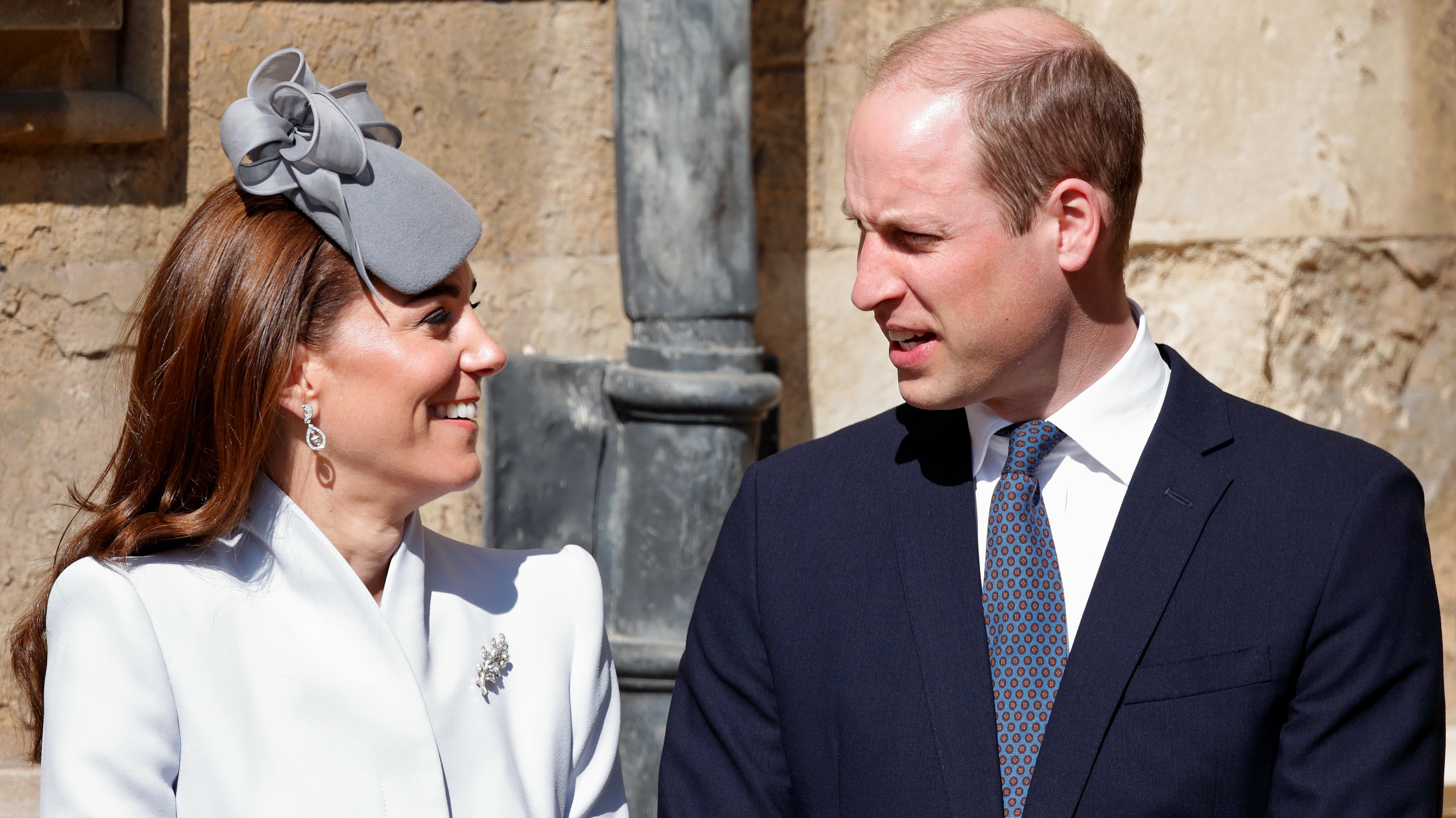 Kate and Prince William look at each other as they attend the traditional Easter Sunday church service at St George's Chapel, Windsor Castle on April 21, 2019