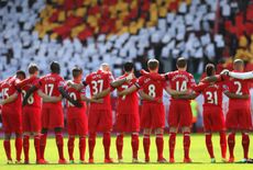 LIVERPOOL, ENGLAND - APRIL 13:The Liverpoolplayers acknowledge a minutes silence for the Hillsborough victims on the 25th anniversary of the tragedy prior to the Barclays Premier League match