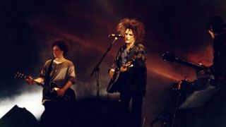 Perry Bamonte and Robert Smith of The Cure perform on stage in Finsbury Park, on June 13th, 1993 in London, United Kingdo