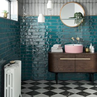 bathroom with wall tiles in shade of teal an peacock colour and monochrome tiled floor