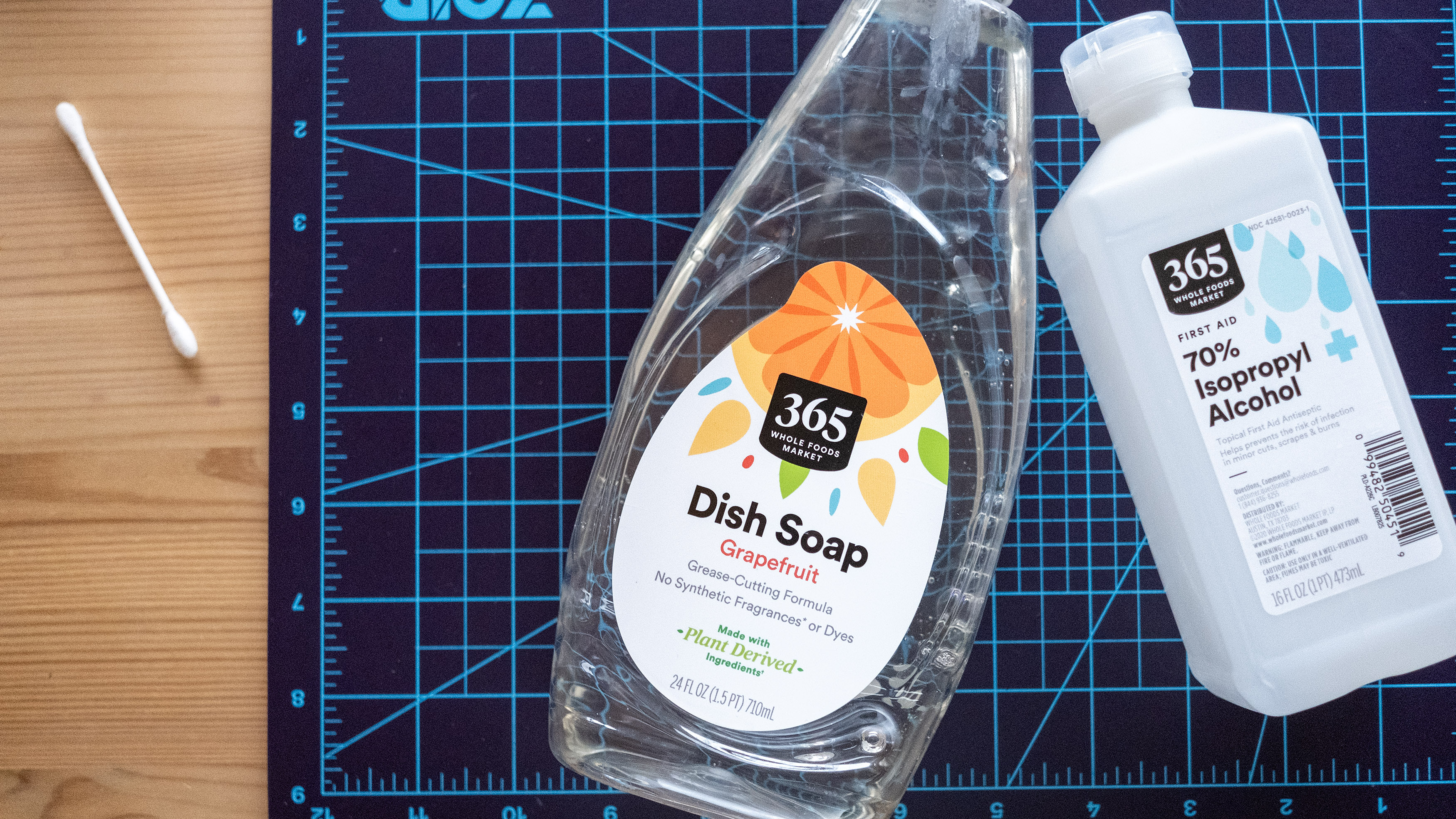 Dish soap and rubbing alcohol for cleaning a fitness tracker.