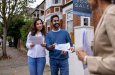 Two first time buyers getting the documents for their new home