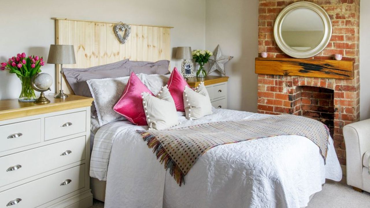 bedroom with white wall and white bed