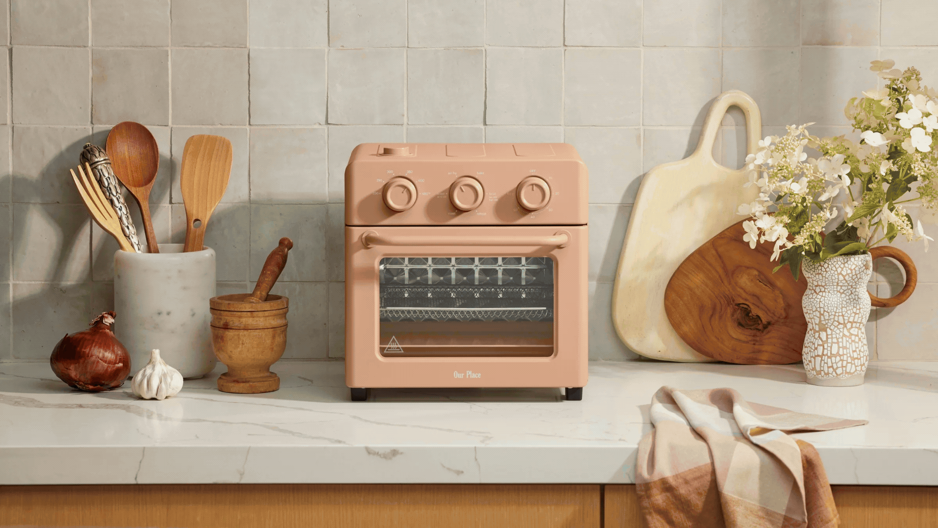 A GIF of the Our Place Wonder Oven in kitchen settings