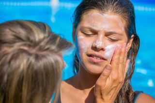 Child with sunscreen