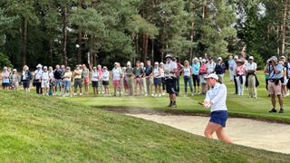 Lottie Woad playing out of a bunker at Curtis Cup 2024