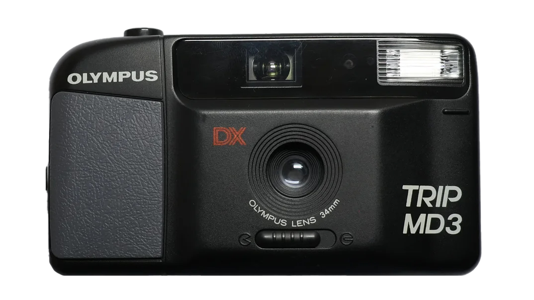 Front view of an Olympus Trip MD3 camera, featuring a 34mm lens, flash, and textured grip, in black casing