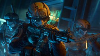Black Ops 7 Mastery Camos: A close-up of three soldiers wearing tactical armour holding assault rifles at the ready while walking through a dark facility.