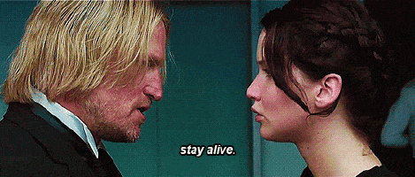A scene for the Hunger Games where Jennifer Lawrence's character is advised to, "Stay alive."