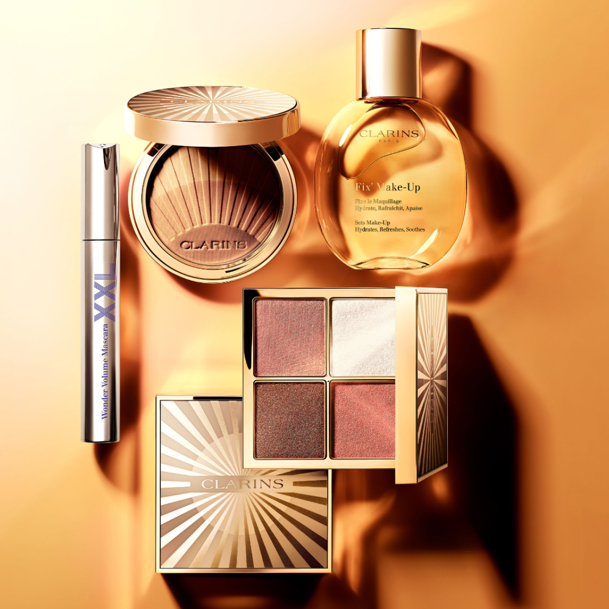 Clarins summer makeup on a bronze background